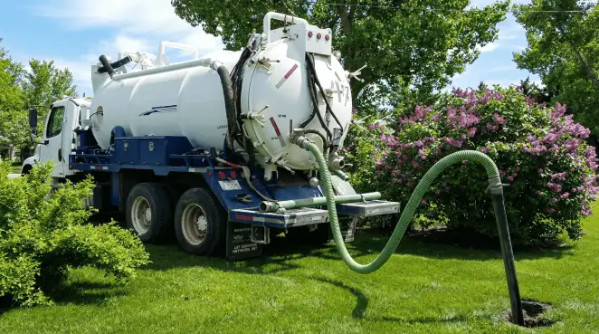 Professional vacuum truck performing residential drainage and septic maintenance in Tacoma, WA